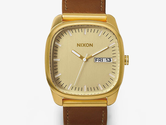 Gold and brown Nixon Identity watch